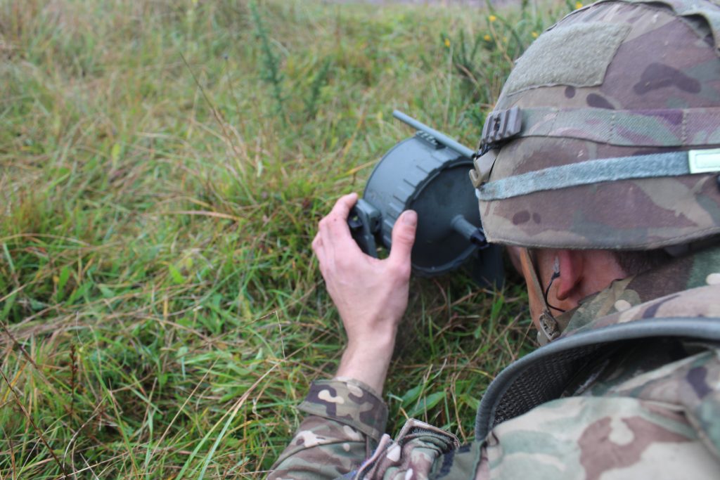 An operator deploying a Vesuvius charge
